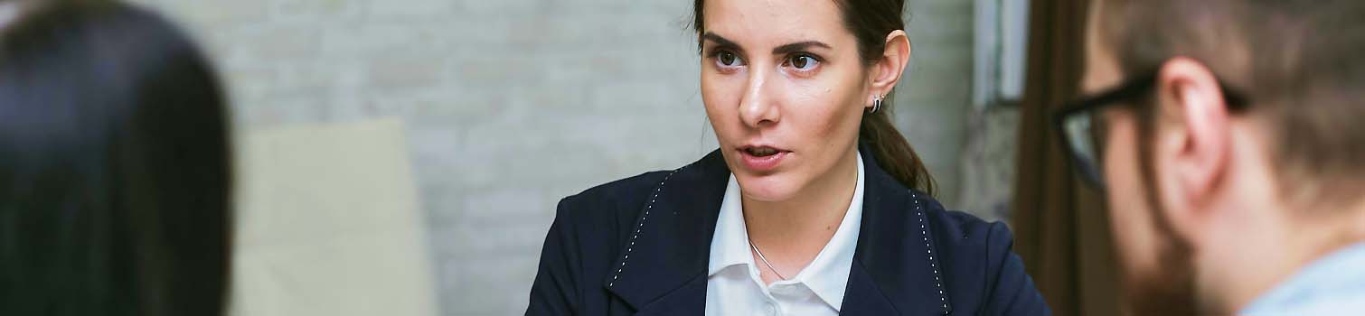 Professional woman speaking with colleagues