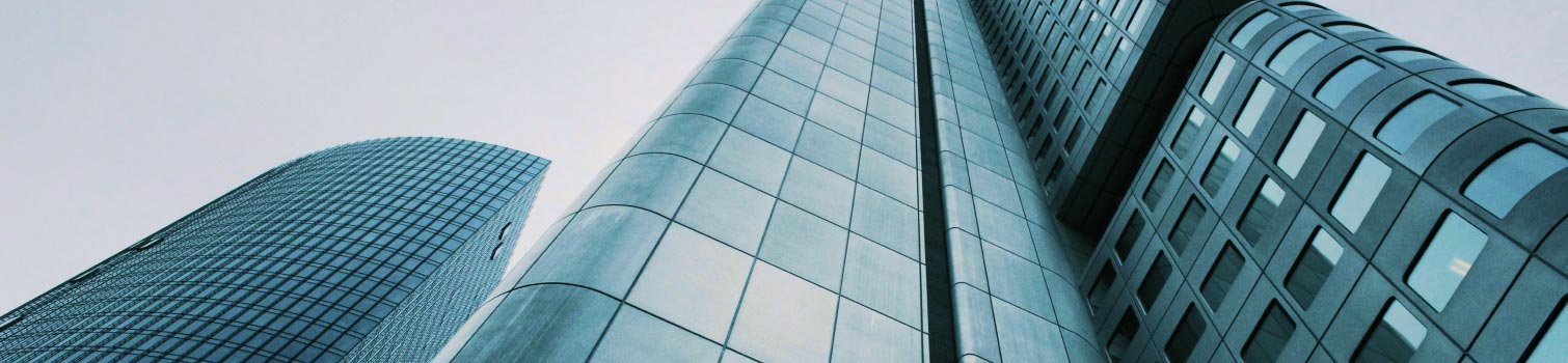 Modern glass office towers viewed from below